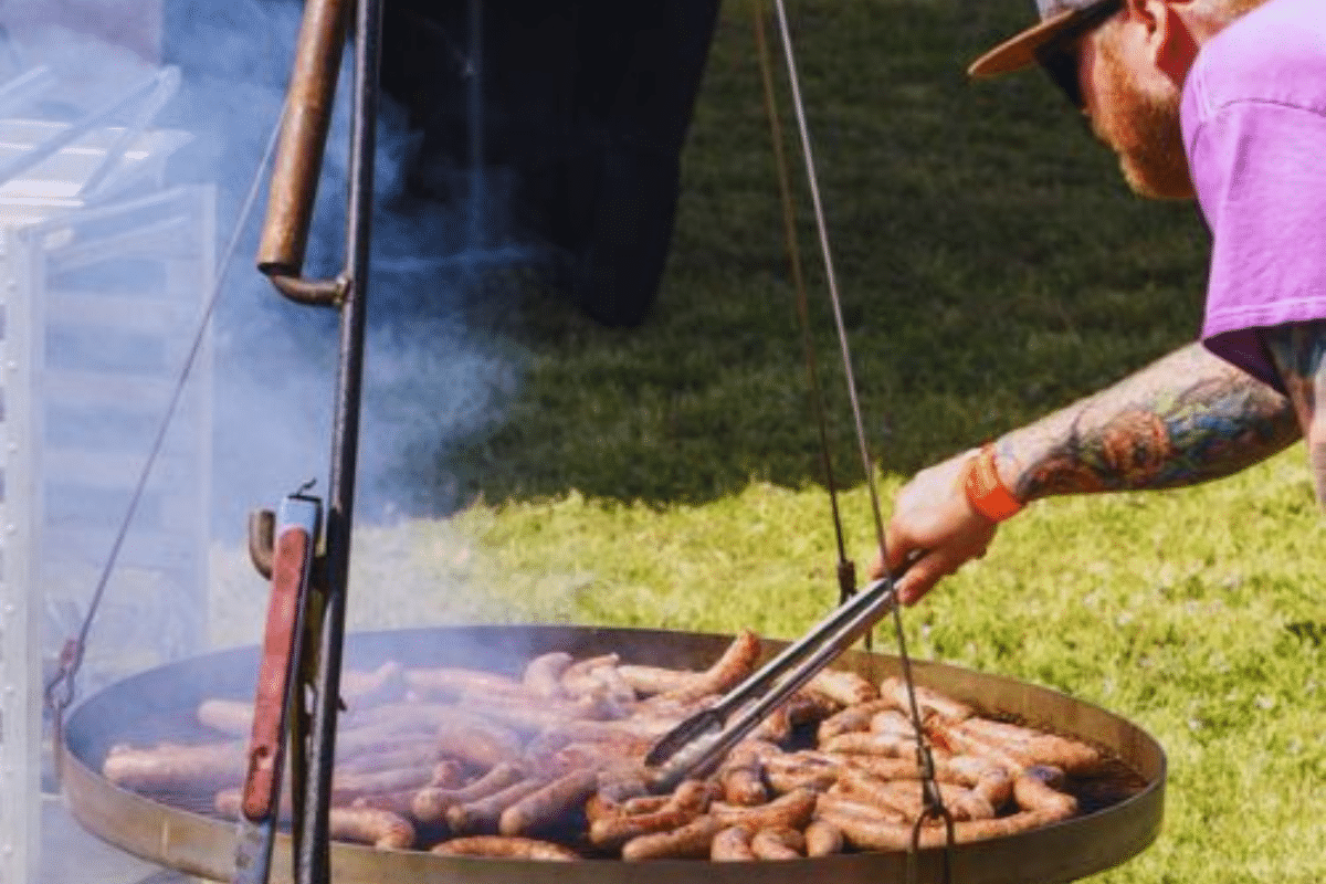 man making food over fire